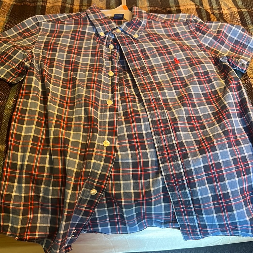 A plaid button down boys shirt